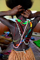 Back of girl at carnival, Eticoga, Orango Island, Bijagos UNESCO Biosphere Reserve, Guinea Bissau, February 2015.