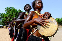 Carnival procession led by drummer, Eticoga, Orango Island, Bijagos UNESCO Biosphere Reserve, Guinea Bissau, February 2015.
