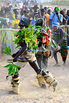 Dancers and spectators at carnival, Eticoga, Orango Island, Bijagos UNESCO Biosphere Reserve, Guinea Bissau, February 2015.