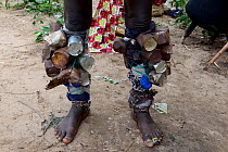 Legs of participant in carnival, covered with tin cans, Eticoga, Orango Island, Bijagos UNESCO Biosphere Reserve, Guinea Bissau, February 2015.