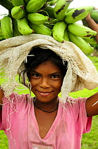 Honduran girl carrying bananas, Rio Platano Biosphere Reserve and UNESCO World Heritage Site, La Mosquitia, Honduras