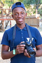 Pupil with DSLR camera during residential photography course organised by Wild Shots Outreach. Kruger National Park, South Africa, June 2017.