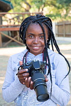 Pupil Tharollo Shaai with DSLR camera during residential photography course organised by Wild Shots Outreach. Kruger National Park, South Africa, June 2017.