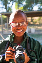 Pupil Lebogang Sekgwari with DSLR camera during residential photography course organised by Wild Shots Outreach. Kruger National Park, South Africa, June 2017.
