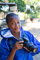 Pupil Evelyn Lekanyane with DSLR camera during residential photography course organised by Wild Shots Outreach. Kruger National Park, South Africa, June 2017.
