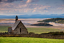 Llandecwyn Chapel overlooking saltmarsh and River Glaslyn estuary as it enters Cardigan Bay, Porthmadog, Gwynedd, Wales, UK, October 2016.