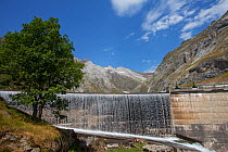 Water rushing over the Barrage d'Ossoue dam at the head of the Ossoue Valley, Pyrenees National Park, France, July 2015.