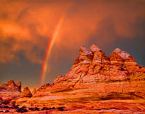 Rainbow over petrified sand dunes at sunset, Vermilion Cliffs National Monument, Paria Canyon-Vermilion Cliffs Wilderness, Arizona, USA.