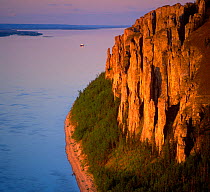 Red cliffs over the Lena River, Lenskie Stolby Regional Park, Lena Pillars UNESCO Natural World Heritage Site, East Siberia, Russia.