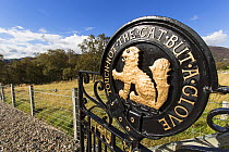 MacPherson clan motto on gate, with reference to Scottish wildcat (Felis silvestris), Scotland, UK, September 2016.
