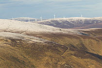 Wind turbines on upland moor in winter, Inverness-shire, Scotland, UK, January 2016.