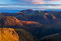 Ben Nevis and the Ring of Steall in the Mamores at sunrise from Sgorr nam Fiannaidh, Lochaber, Scotland, UK, October 2016.