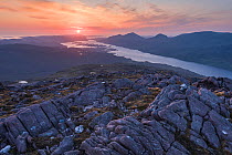 Sunset over Loch Maree from the summit of Meall a' Ghiuthais, with view to Beinn airigh charr on right and Loch Bhanamhoir on left, Torridon, Scotland, UK, June 2016.