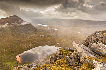 Lochan Bealach Cornaidh and Quinag ridge from Spidean Coinich in stormy weather, Assynt, Sutherland, Scotland, September