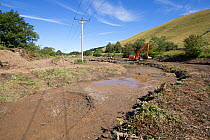 Excavation works being carried out along river as part of re-naturalisation of river course to reduce flooding. Part of Eddleston Water Project led by Tweed Forum, Peebles, Tweeddale, Scotland, UK, Ju...