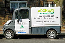 Electric Vehicle advertising free home energy visits, Archway,   Islington, England, UK, September 2011.