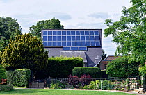 Solar panels on roof of Muswell Hill Methodist Church with garden in front, Haringey, England, Britain, UK, September 2015.