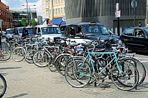 Bike racks and taxies with St Pancras Station behind London, England, UK,  August 2014.