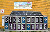 Brompton Bike Dock, lockers holding Brompton folding bicycles for hire outside the Whittington Hospital. The solar panels above provide all the energy needed to power the Dock. Islington, England, UK,...