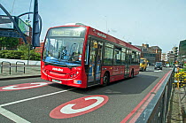 Single-decker bus entering congestion charge zone, Old Street Roundabout, London Borough of Islington, England, UK, June.