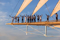 Crew standing on the bowsprit of the  Sailing ship Starflyer (Star Clippers fleet) in Pacific Waters, Costa Rica.
