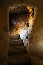Stairway in underground Troglodyte village, Goreme National Park and the Rock Sites of Cappadocia UNESCO World Heritage Site. Turkey. December 2009.