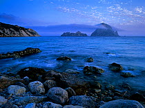 Es Vedranell and es Vedra' islands seen at dusk from Cala d'Hort, Ibiza, biodiversity and culture UNESCO World Heritage Site,  Spain.