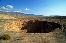 Sinkhole on the Kugitang Plain, Turkmenistan, 1990. Small repro only.