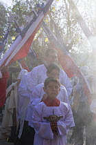 Priest and choir boys participating in Cuasimodo, a Catholic festival, Colina, Chacabuco Province, Santiago Metropolitan Region, Chile, Latin America. April 2017.