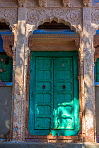 Green door in the Blue City,  Jodhpur, Rajasthan, India. March 2015