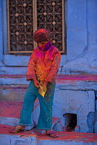 Children covered in colour powder in Holi festival,  Jodhpur, Rajasthan, India. March 2015
