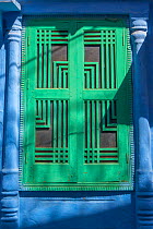 Green door in the Blue City, Jodhpur, Rajasthan, India. March 2015