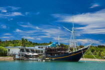 View from the water of the Manta Ray Bay Resort and The Mnuw Floating Restuarant on the island of Yap, Micronesia. September 2007.