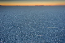 Salt pan, Salar de Uyuni at sunrise, Altiplano, Bolivia, April.