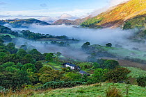 Early morning mist in the Gwynant Valley looking south west over Llynn Gwynant, Snowdonia National Park, North Wales, UK, September 2017