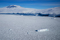 Sea ice and iceberg, Mount Erebus, Ross Island, Ross Sea, Antarctica. Photographed for The Freshwater Project