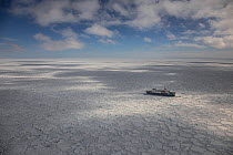 Aerial view of MV Ortelius in  sea ice, near Ross Island, Ross Sea, Antarctica. Photographed for The Freshwater Project
