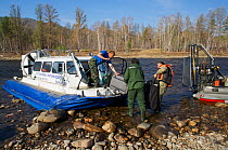 Preparation of Hivus-10 hovercraft  for expedition on the Temnik River, Baikal Nature Reserve, Buryatia, Siberia, Russia, May 2015.