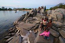 Children of a nearby fishing village on the shore of Lake Malawi, , Malawi. November 2015. Photographed for The Freshwater Project.