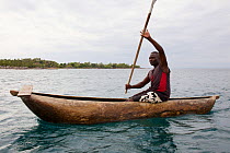 Fisherman in traditional dugout canoe, Lake Malawi,  Malawi, November 2015. Photographed for The Freshwater Project