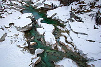Snow covered rocks in the Verzasca River, Lavertezzo area, Canton Tessin, Switzerland , February. Photographed for the Freshwater Project.