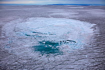 Aerial view of meltwater lake with collapsed ice cover on ice cap north-east of Sermeq Kujalleq Glacier, Ilulissat Icefjord UNESCO World Heritage Site, Sermersuaq / Greenland ice sheet, Greenland, Aug...