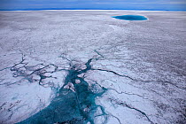 Aerial view of meltwater channels and meltwater lake on the ice cap north-east of Sermeq Kujalleq Glacier, Ilulissat Icefjord UNESCO World Heritage Site,  Sermersuaq / Greenland ice sheet, Greenland,...