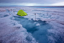 Base camp at meltwater lake on ice cap north-east of Sermeq Kujalleq Glacier,   Ilulissat Icefjord UNESCO World Heritage Site, Sermersuaq / Greenland ice sheet, Greenland. August 2014. Photographed fo...