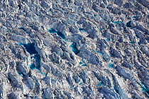 Aerial view of crevasses with meltwater on the Sermeq Kujalleq Glacier or Jakobshavn Isbrae, near Ilulissat Icefjord UNESCO World Heritage Site, Greenland. August 2014. Photographed for The Freshwater...