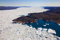 Aerial view of the Ilulissat Icefjord, with the Sermeq Kujalleq Glacier or Jakobshavn Isbrae entering the sea, near  Ilulissat Icefjord UNESCO World Heritage Site, Greenland. August 2014. Photographed...