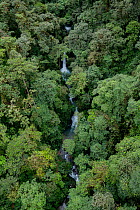 Waterfall inside a rainforest located in a transition between Choco and cloud forest. Mashpi, Pichincha, Ecuador.