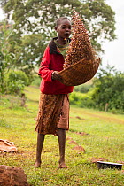 Girl winnowing beans, Kenya, August 2017.