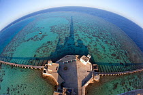 Panoramic view of reef and pier from Lighthouse, Sanganeb Reef, Sudan, Red Sea. May 2011.