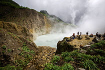 People watching the 'Boiling Lake', a flooded fumarole 10.5 km east of Roseau, Morne Trois Pitons National Park, UNESCO World Heritage Site, Dominica. February 2015.